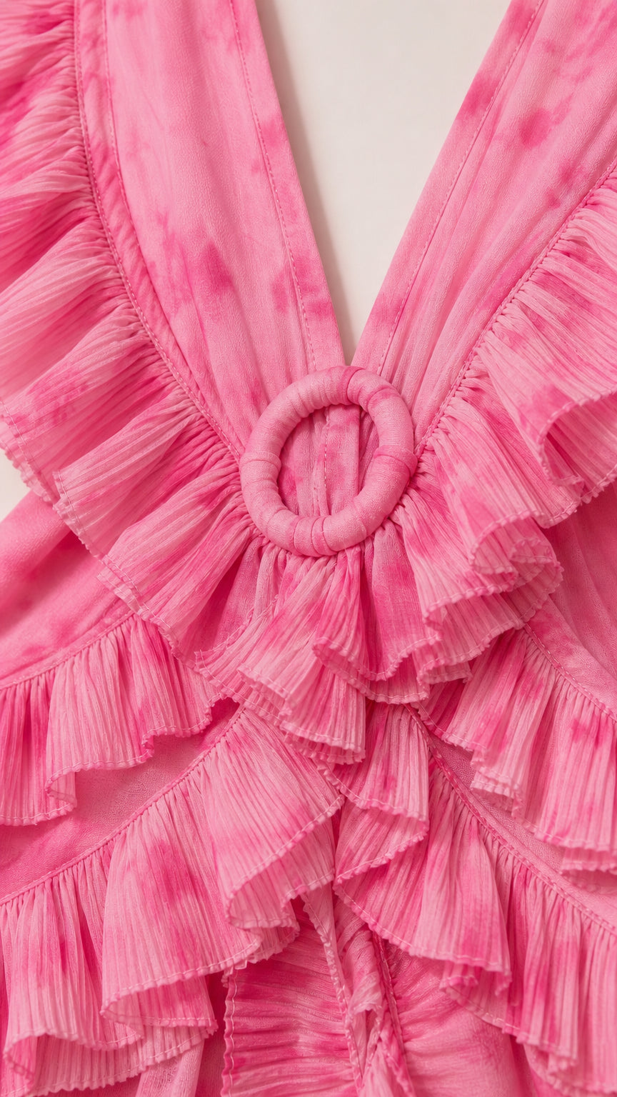 Close up of bodice featuring ring detail and ruffles