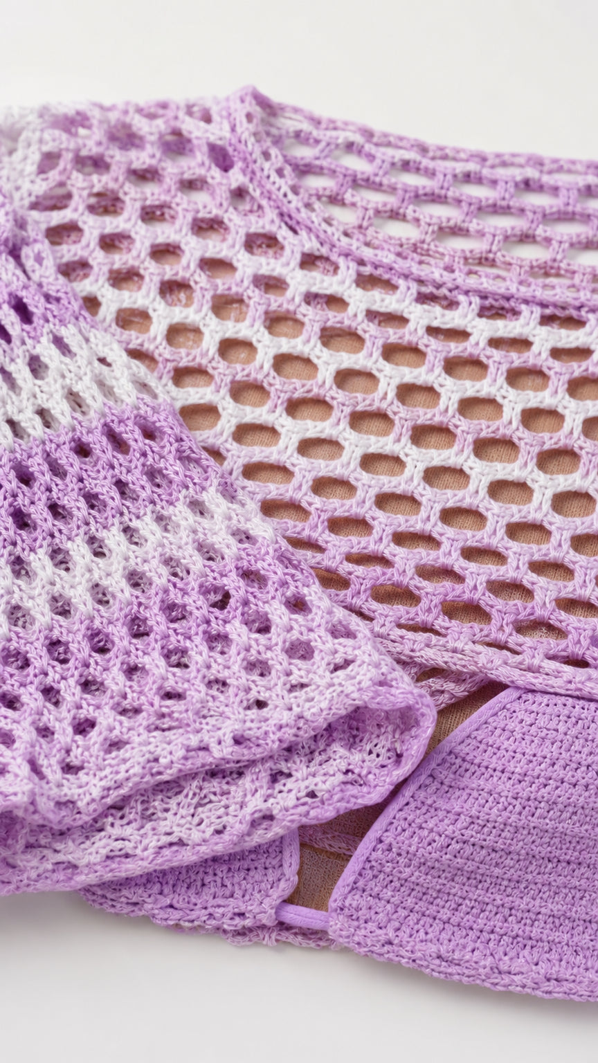 Close-up detail of purple open knit texture