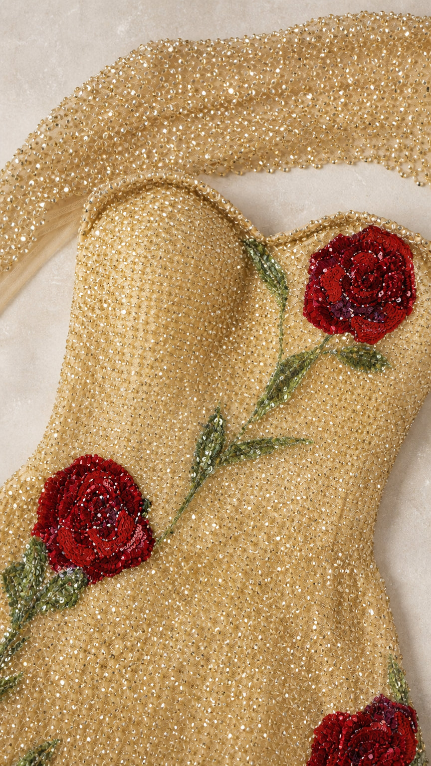 Close-up detail of sweetheart neckline and textured rose embroidery