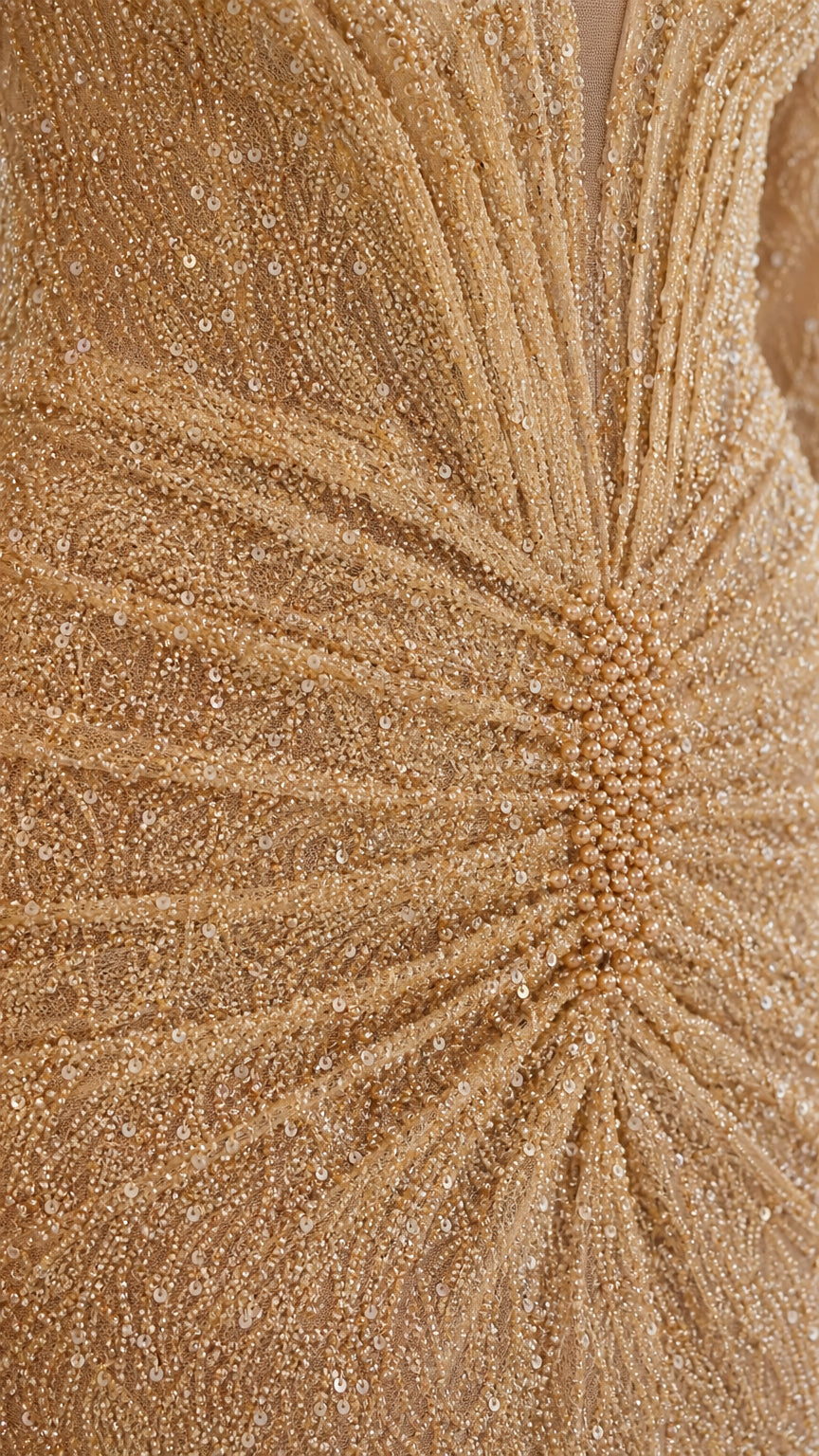 Close-up detail of intricate waist beadwork on evening gown