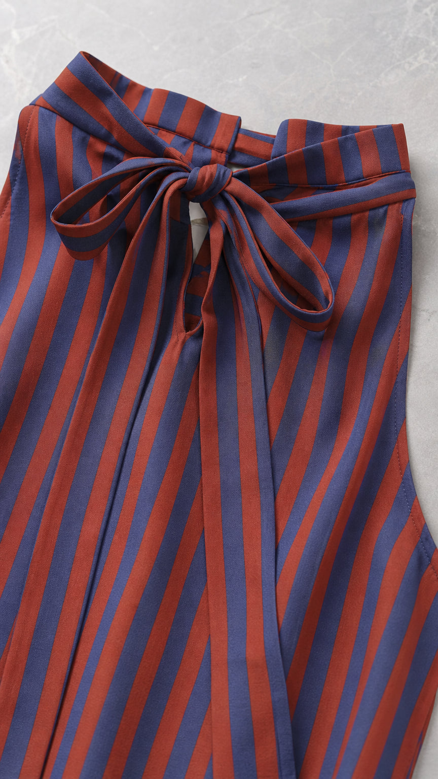 Close-up of back bow tie collar on striped dress