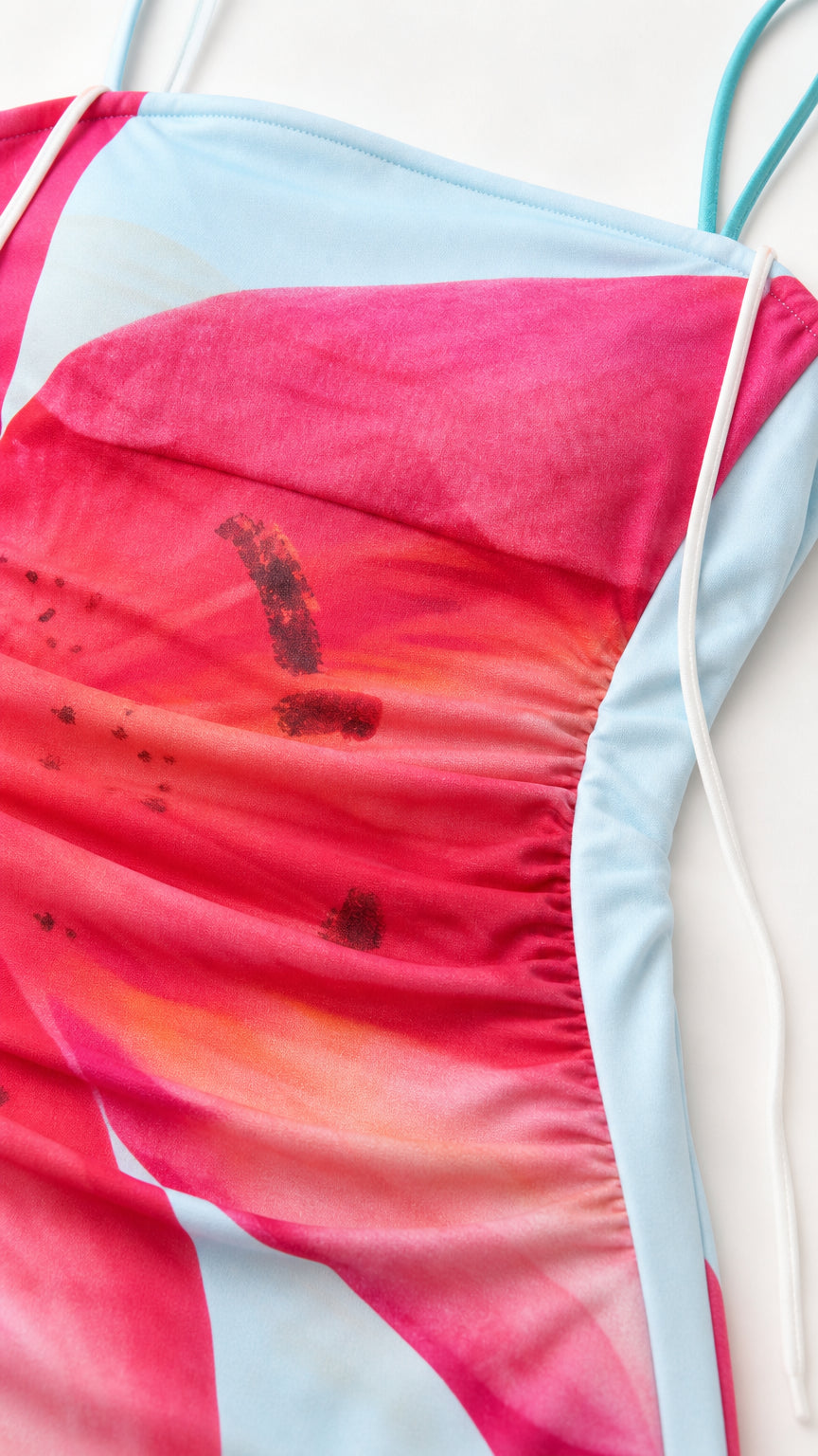 Close-up detail of floral pattern and side ruching drawstrings