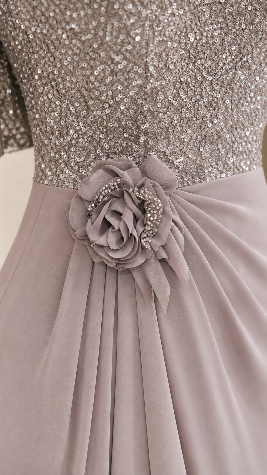 Close-up of sequin bodice and floral waist detail