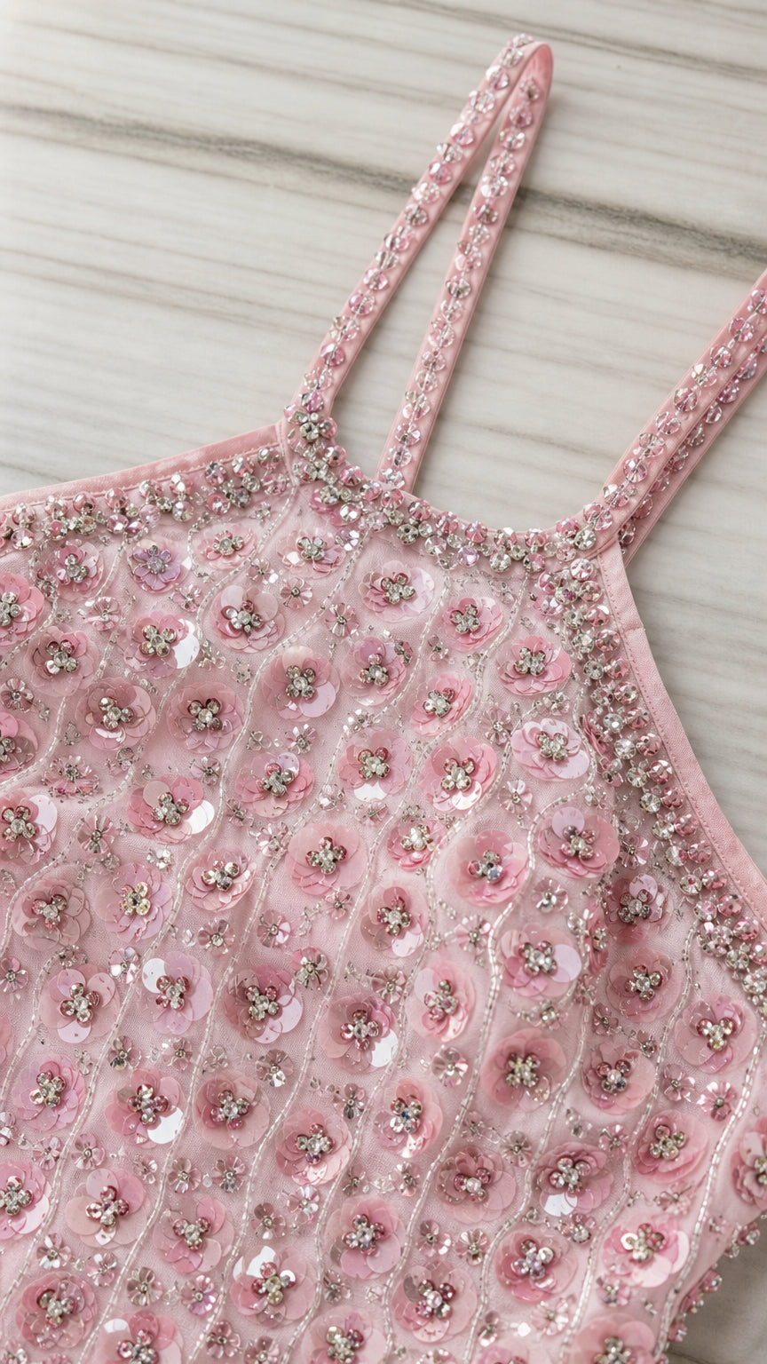 Close-up detail of halter neckline, straps, and sequin beadwork