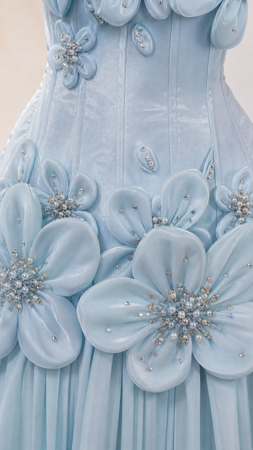 Close-up detail of 3D fabric flowers and crystal beading on bodice