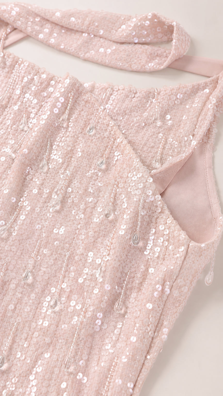 Close-up of sequin fabric texture and neckline construction