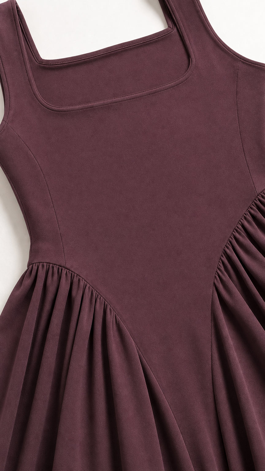 Close-up of square neckline and fitted bodice on burgundy dress