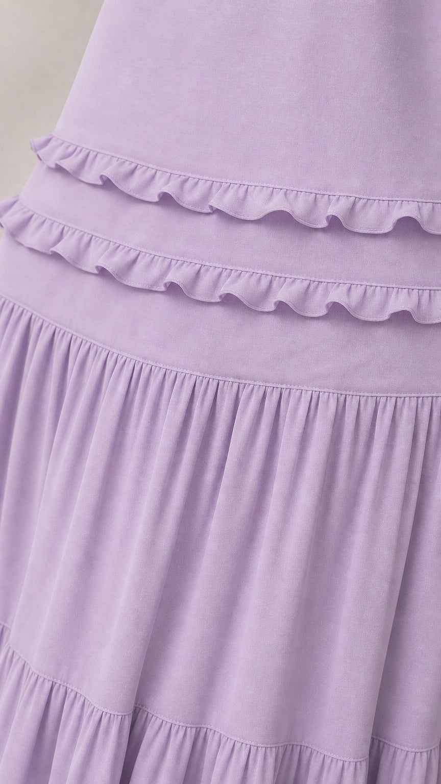 Close-up detail of ruffle tiers and fabric texture