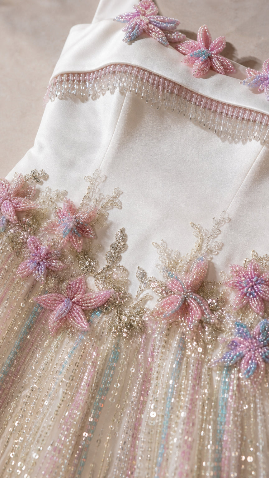 Close-up detail of 3D floral beadwork on bodice