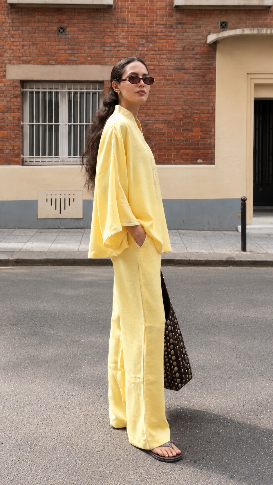 Side view of butter yellow flowy tunic and wide-leg pants matching set