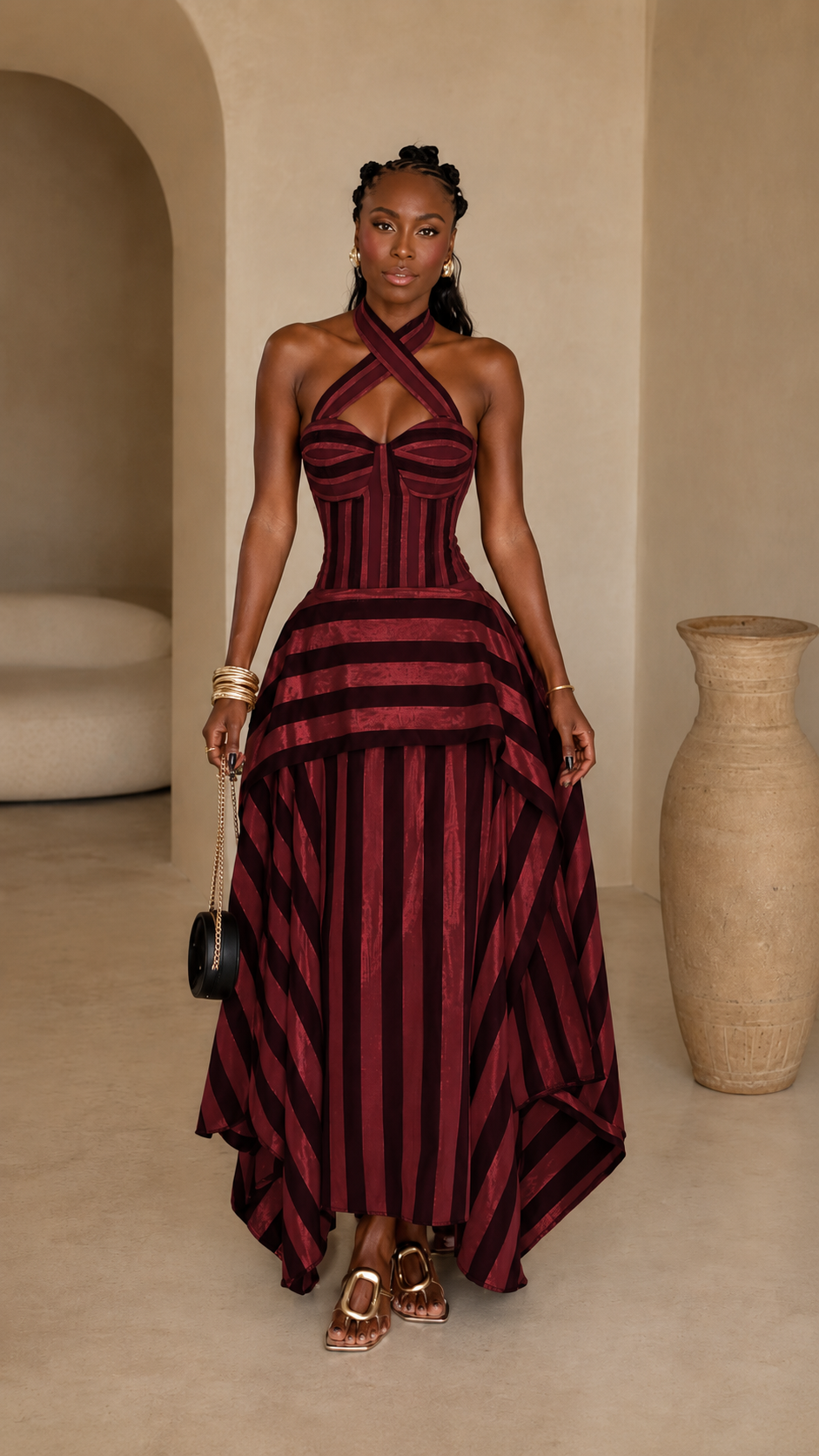 Front view of burgundy striped cross halter corset maxi dress