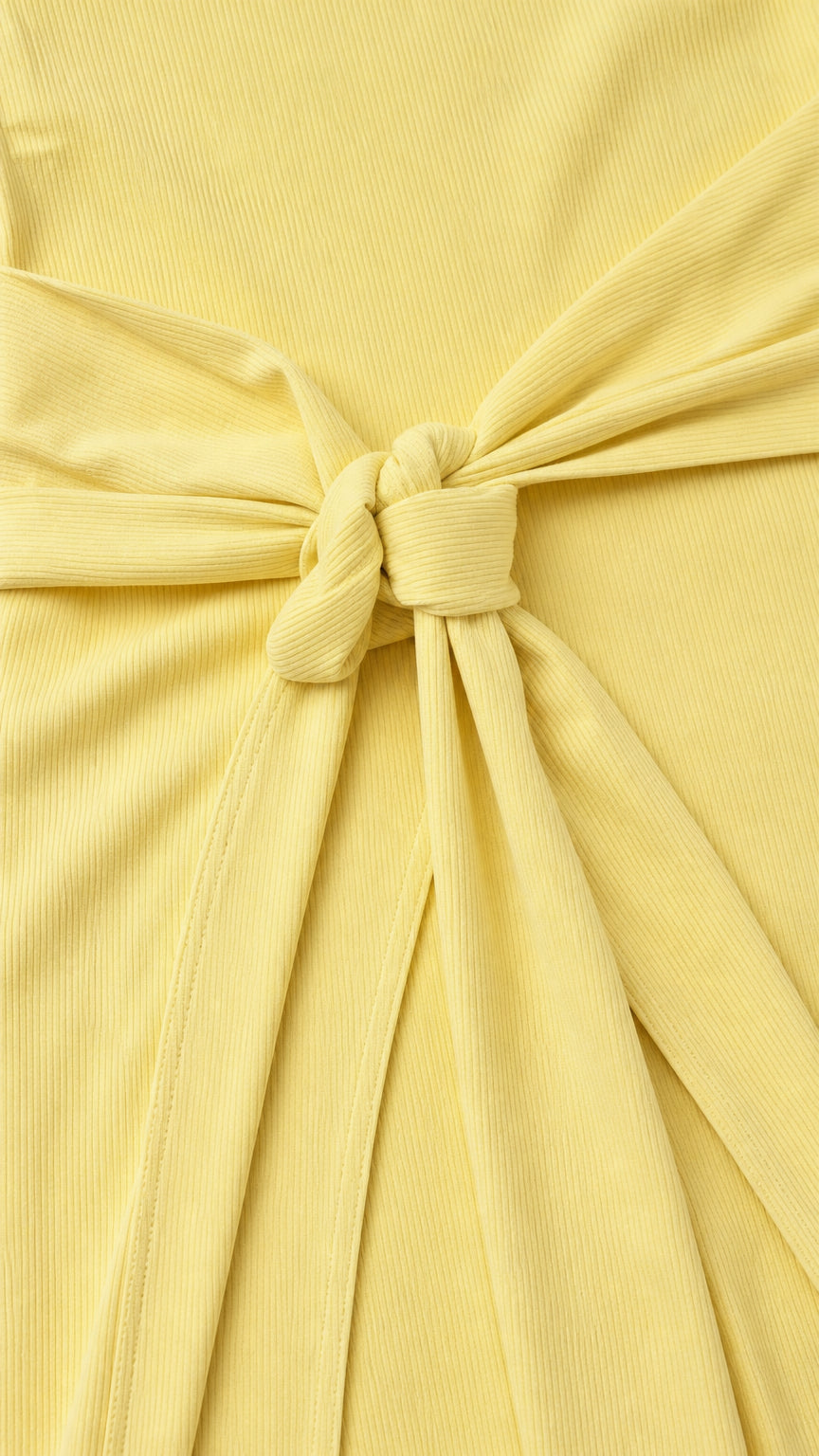 Close-up detail of the ribbed texture and front tie knot