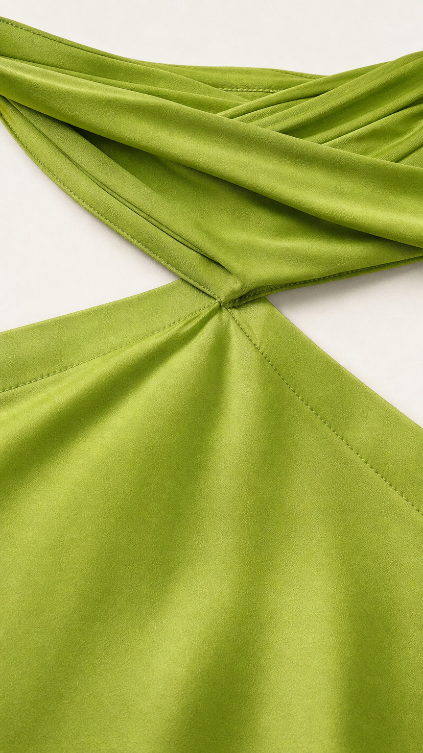 Close-up detail of the halter neckline and shoulder straps