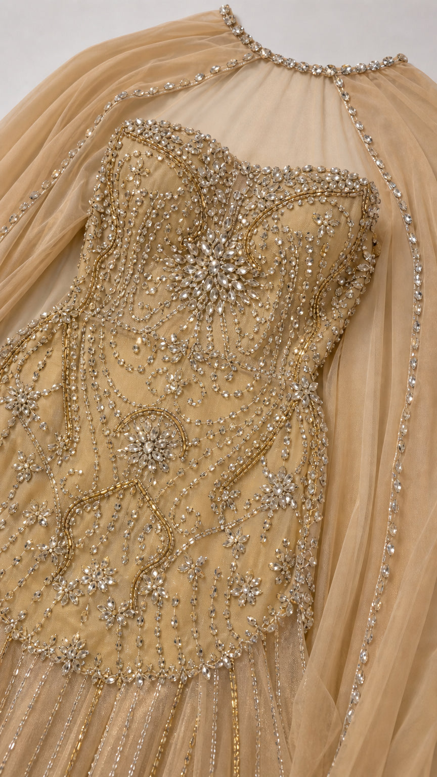 Close-up detail of bodice beadwork and rhinestone neckline