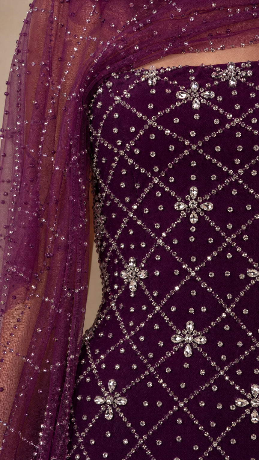 Close-up detail of crystal rhinestone beadwork and sheer shawl