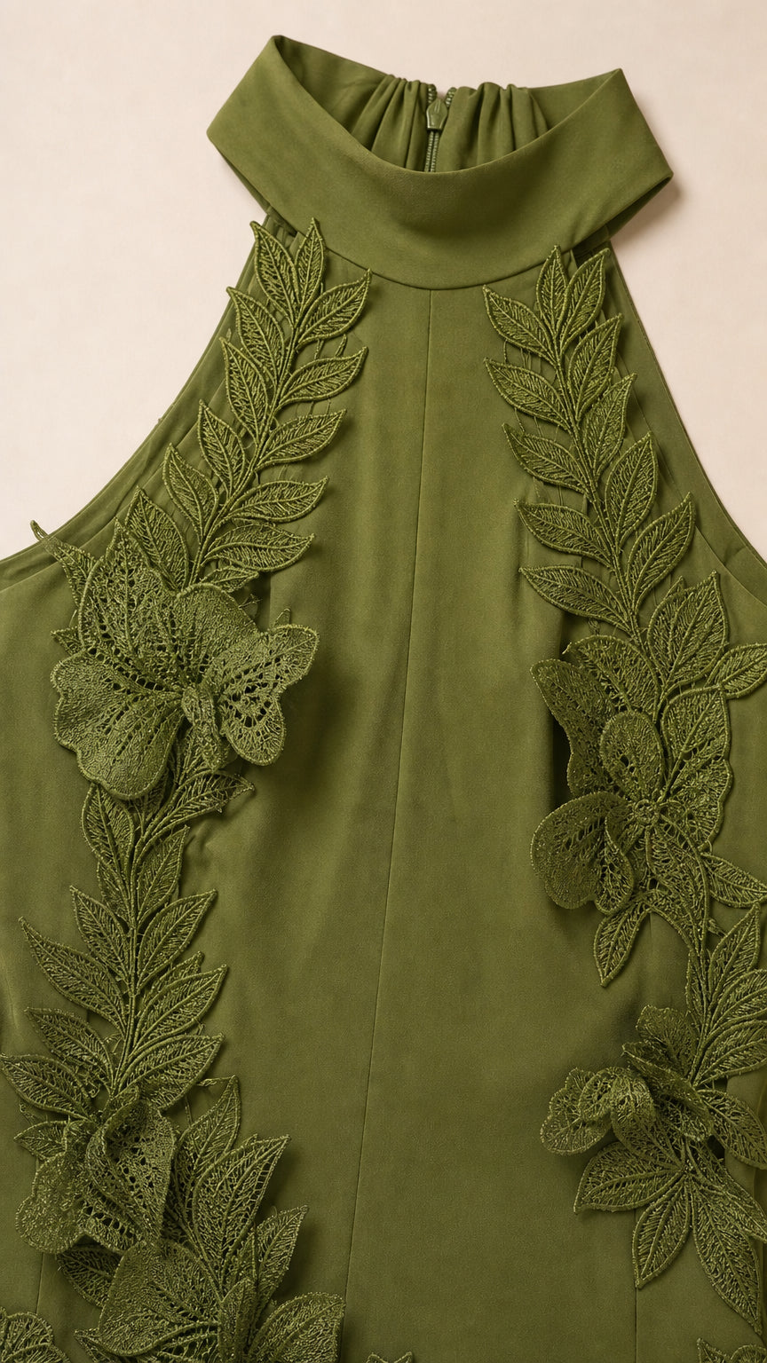 Close-up detail of halter neckline and 3D leaf appliques in olive