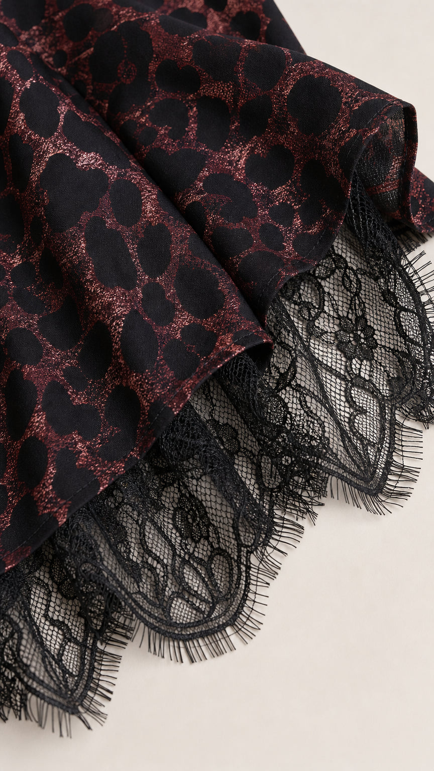 Close up of leopard print fabric and black lace hem