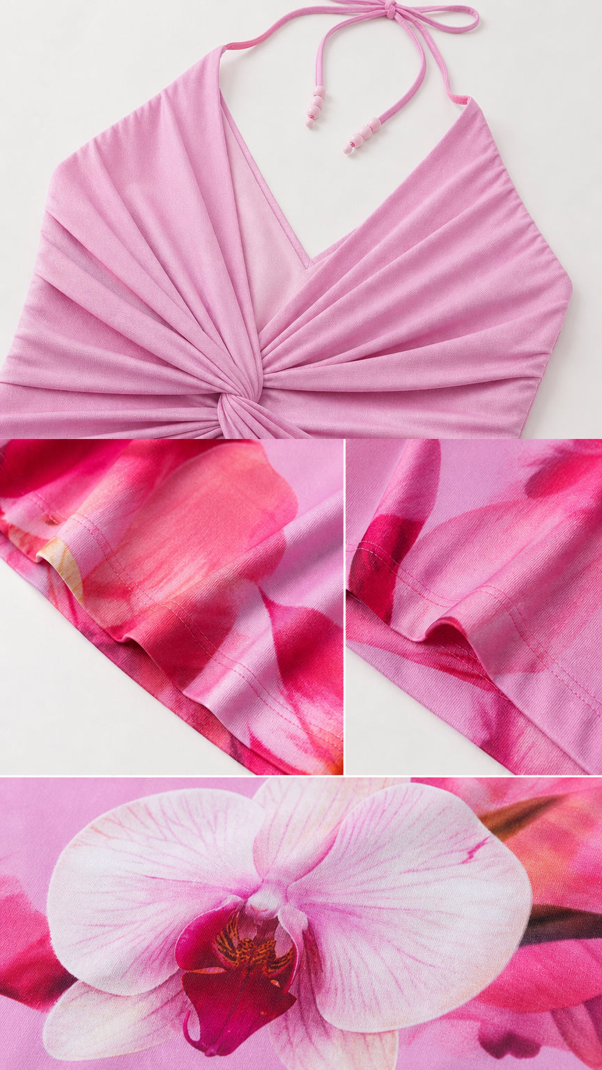 Close up of halter neck, twist front bodice, and floral fabric texture