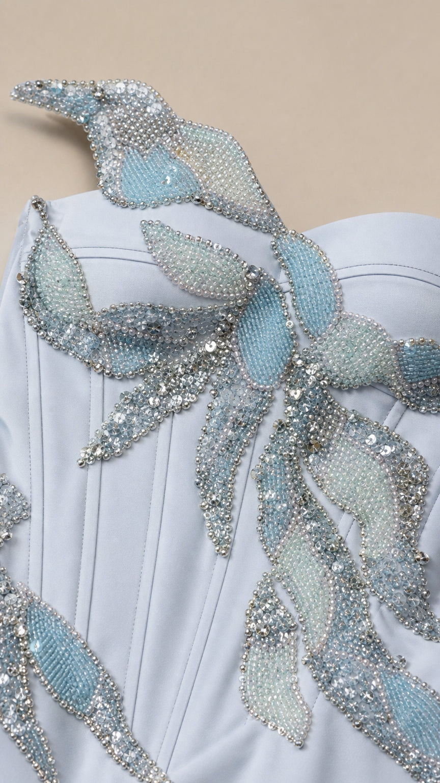 Close-up detail of crystal beaded leaf appliqué on bodice