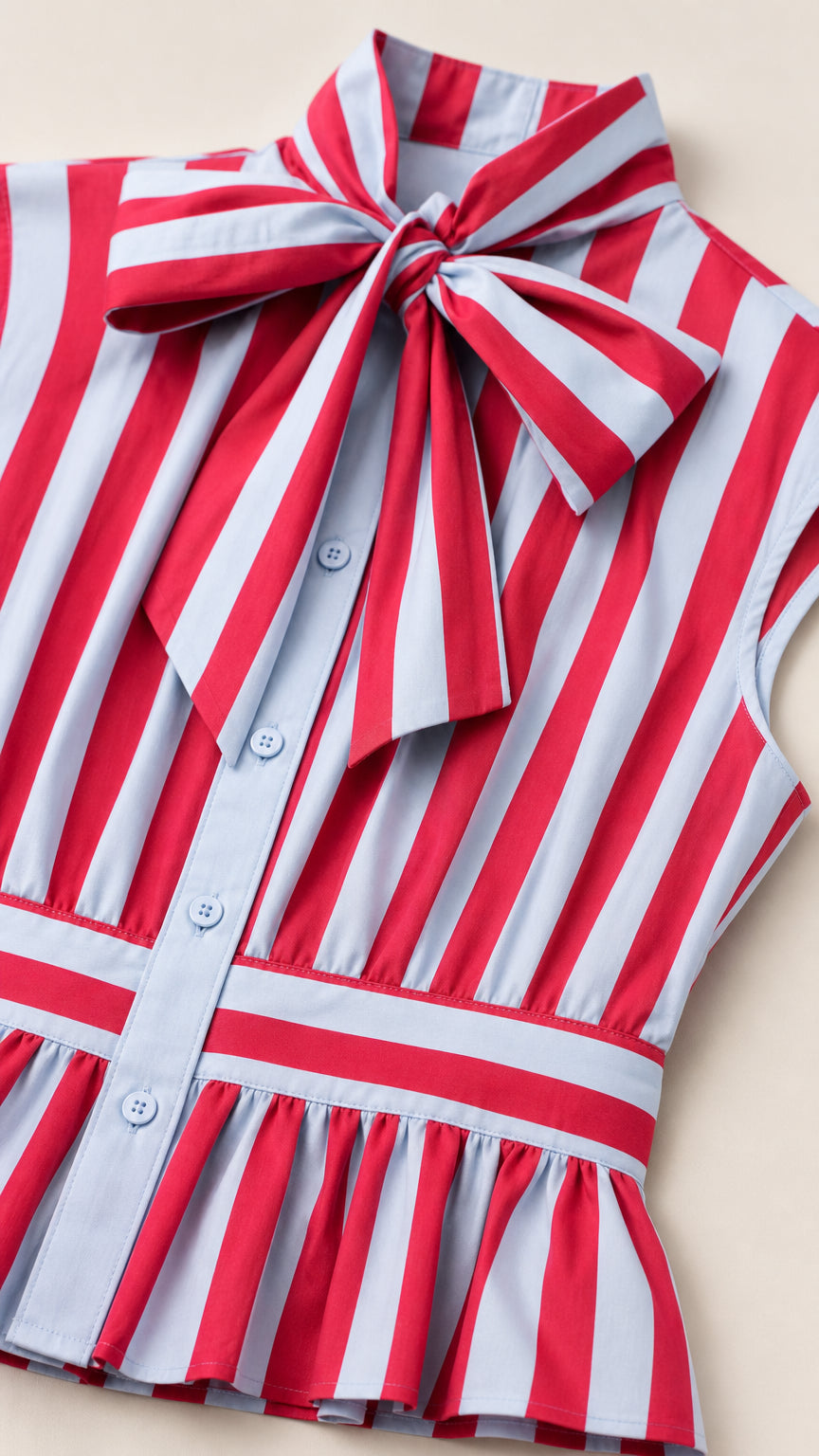 Close-up detail of red and white striped bodice and bow