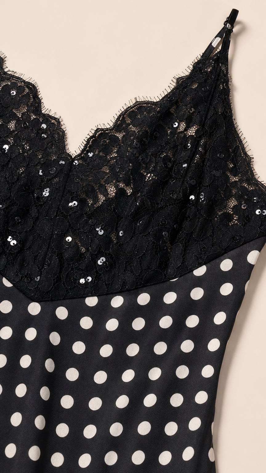 Close-up of black lace and sequin bodice detail