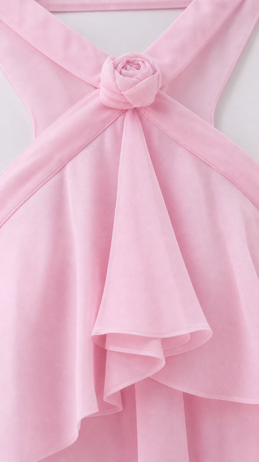 Close-up of halter neckline and fabric rosette detail