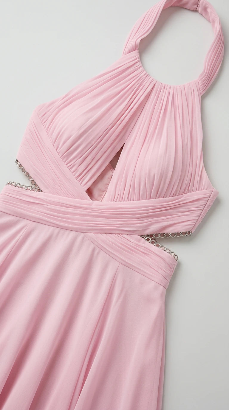 Close-up detail of pink chiffon dress bodice and rhinestone waist trim