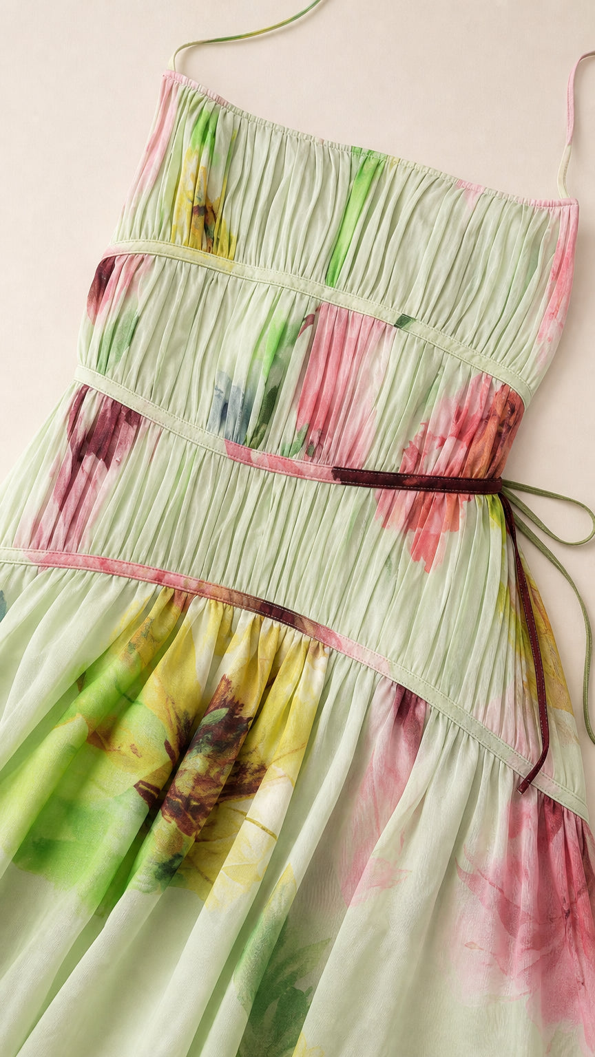 Close-up detail of smocked bodice and floral print on Light Green dress