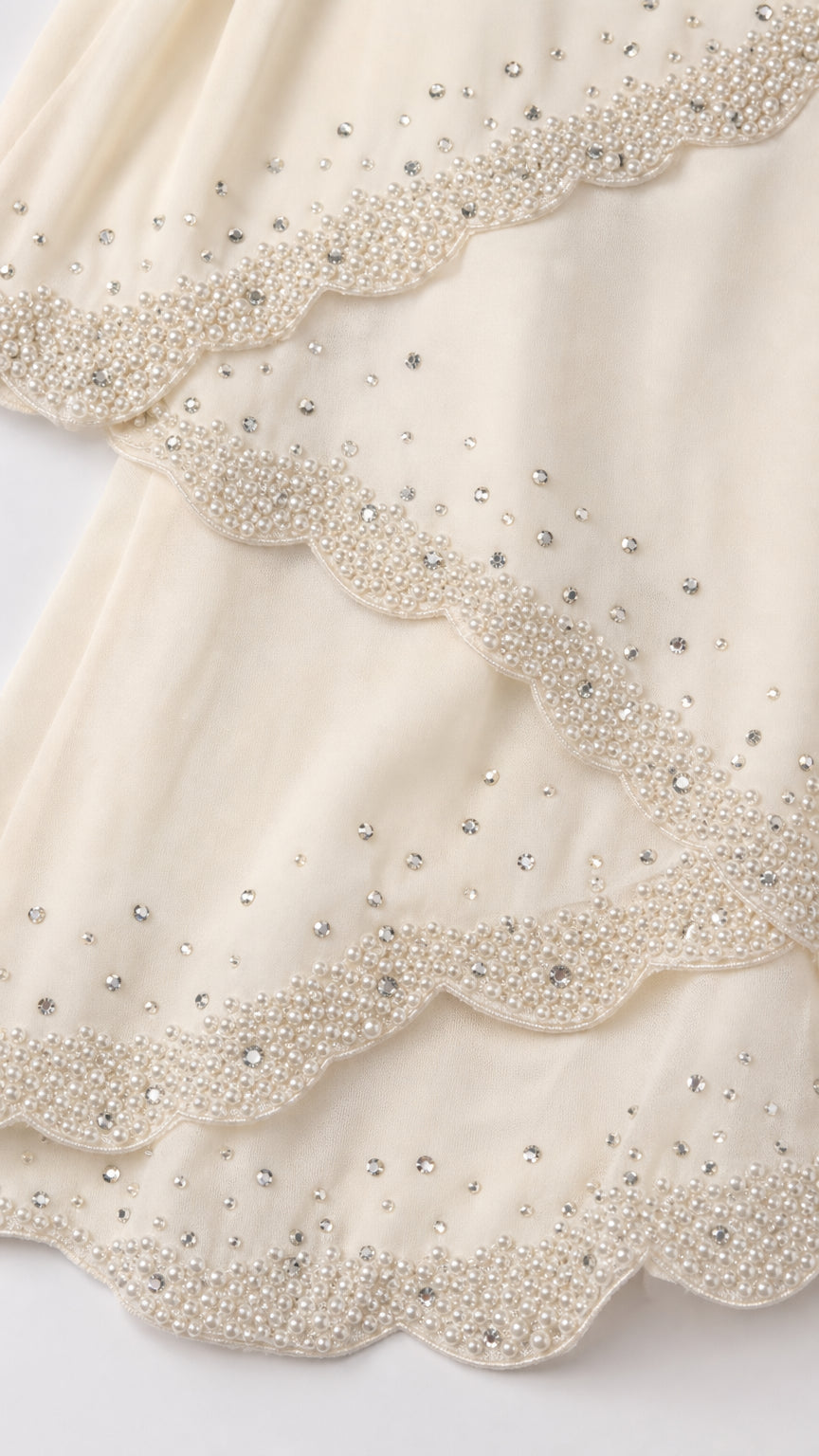 Close up detail of beaded scalloped tiers