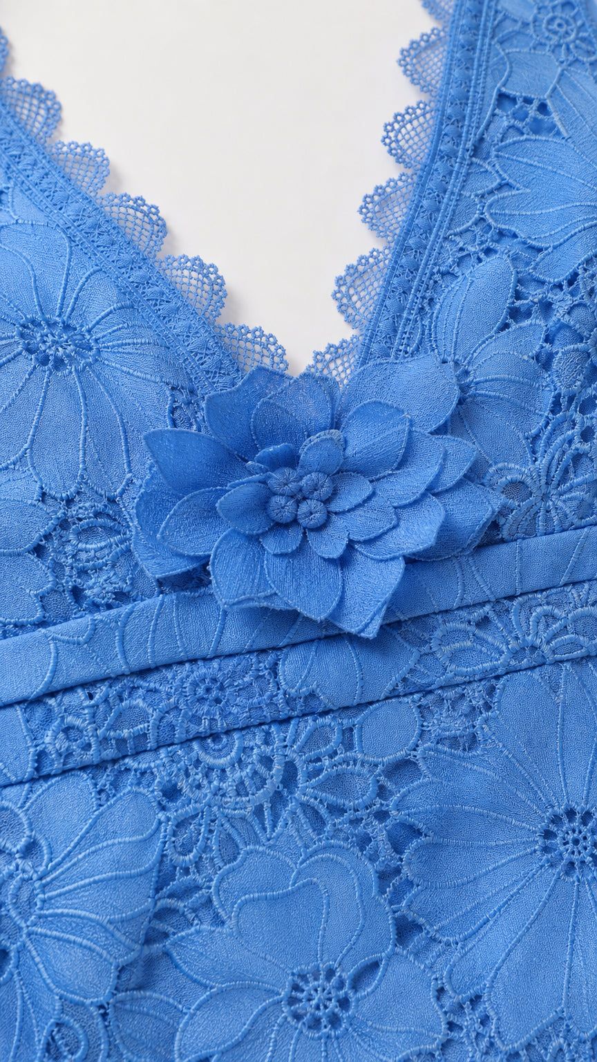 Close-up detail of lace bodice and 3D flower accent