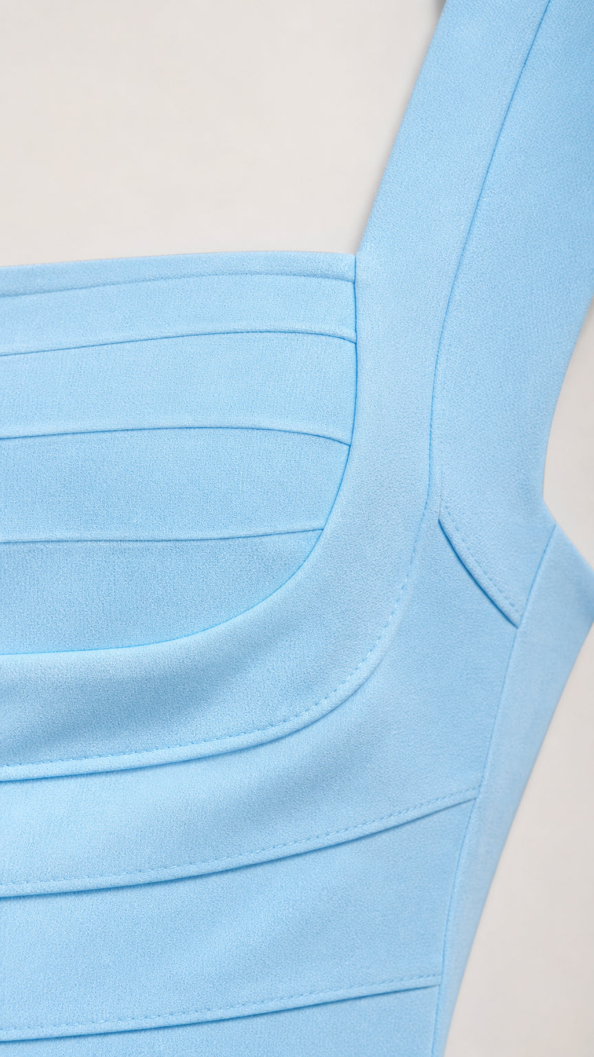 Close-up detail of square neckline and banded texture