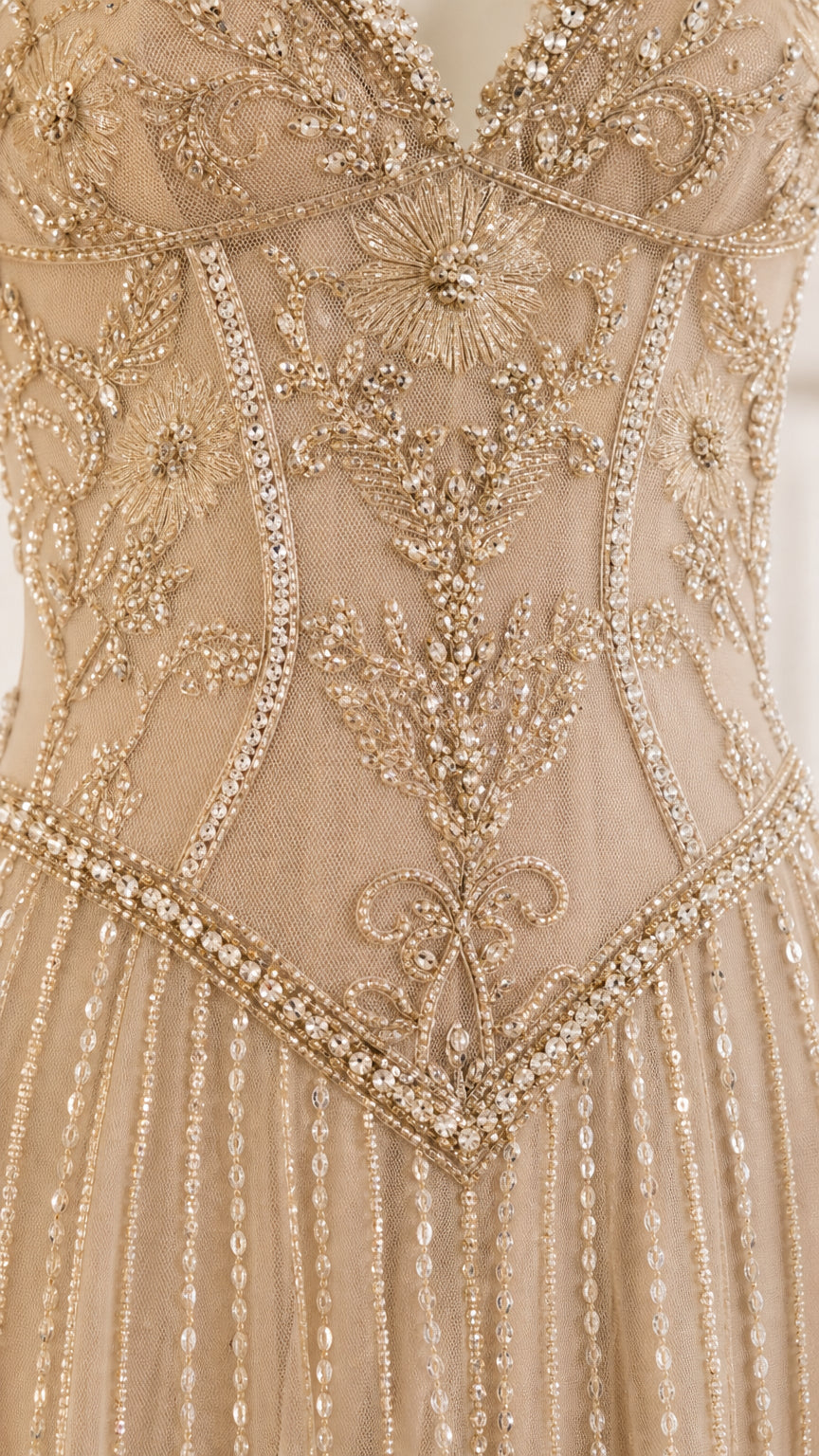 Close-up detail of intricate bodice beadwork and embroidery