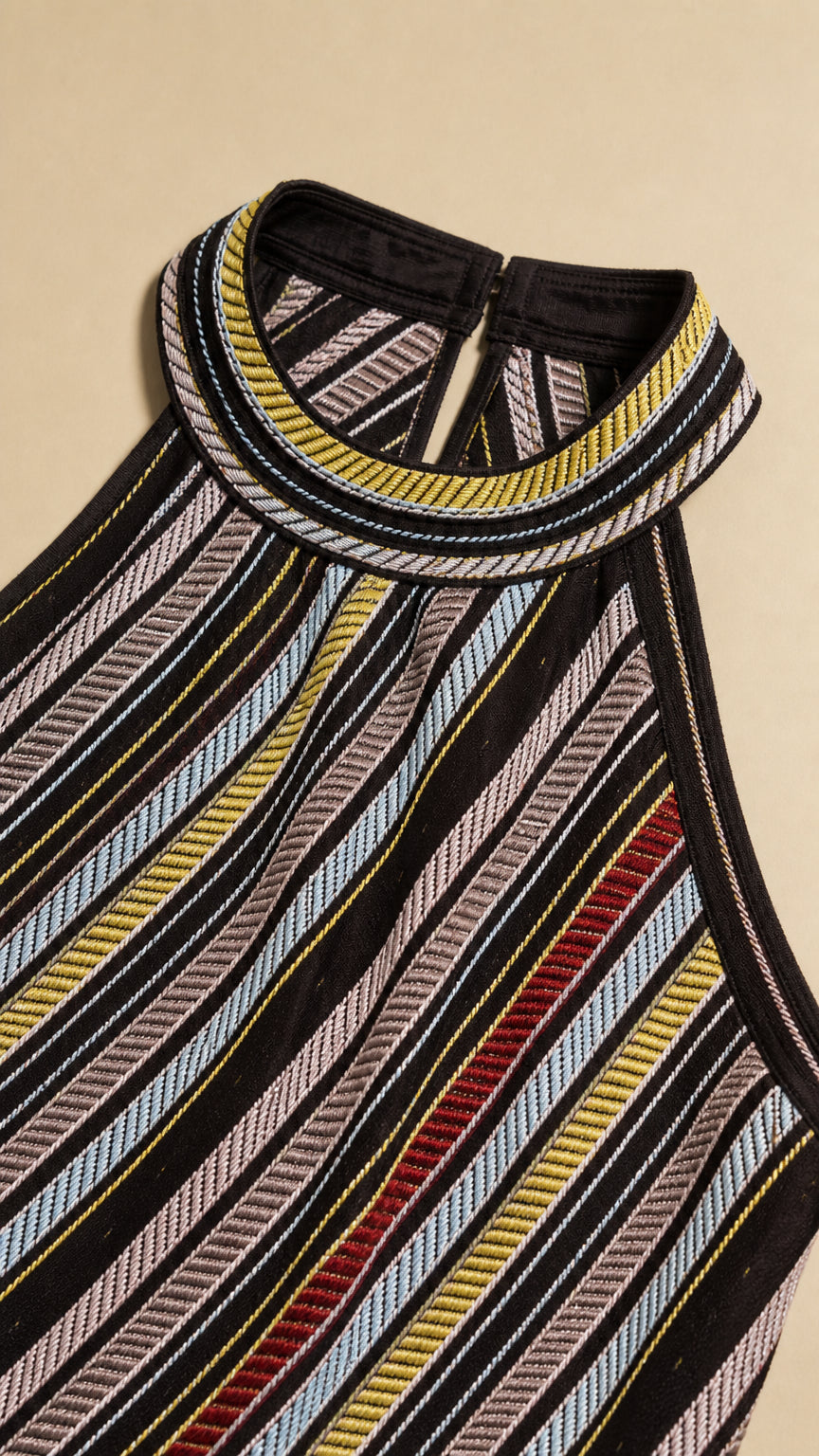 Close-up detail of halter collar and striped knit texture