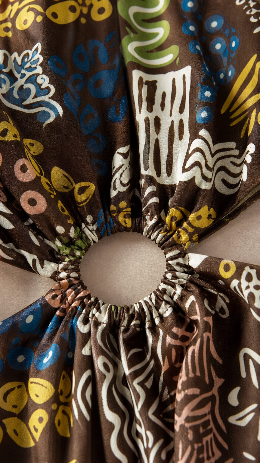 Close-up detail of the waist cutout ring and patterned fabric