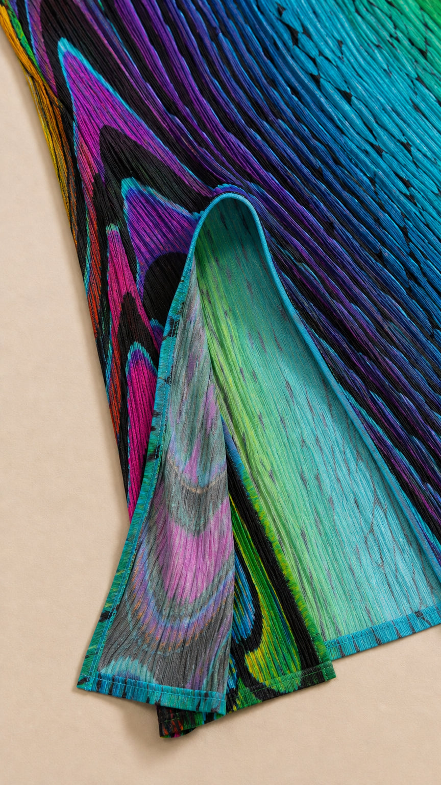 Close-up detail of the textured green and blue abstract fabric and hem