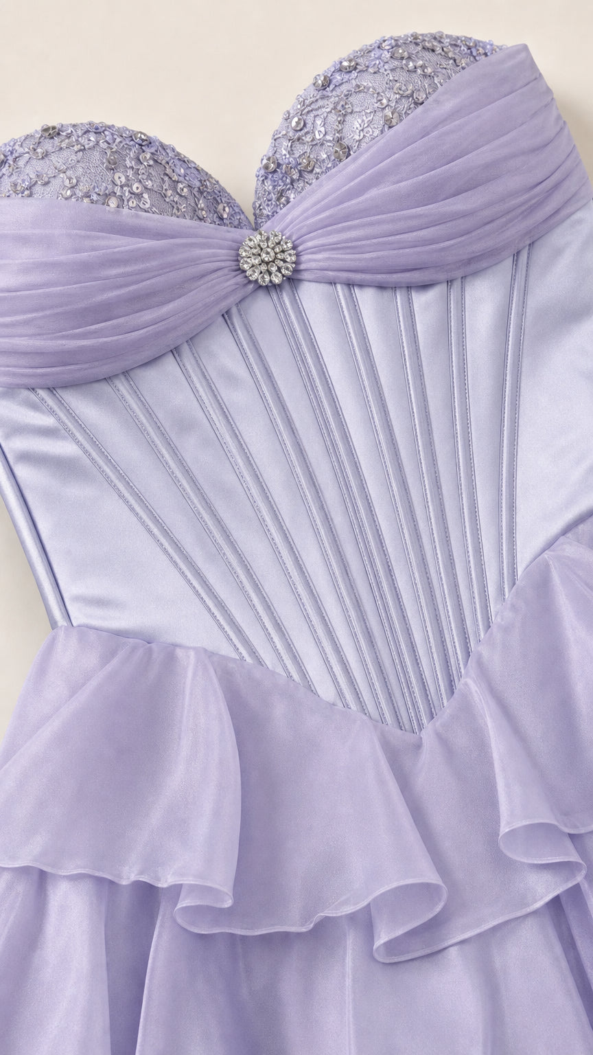 Close-up of lavender sweetheart corset bodice with crystal brooch and beading