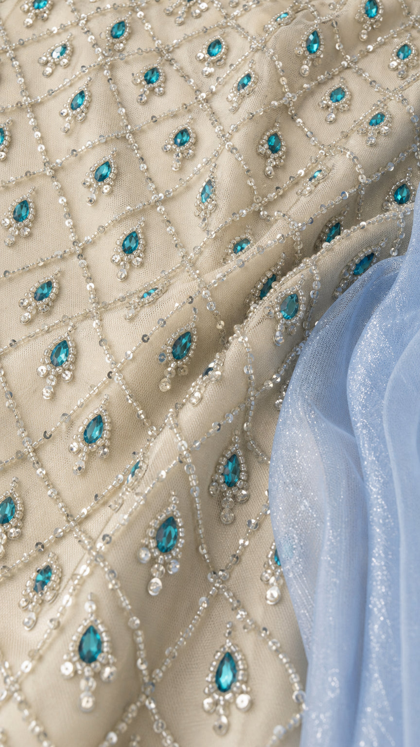 Close-up detail of geometric beaded fabric and rhinestone embellishments