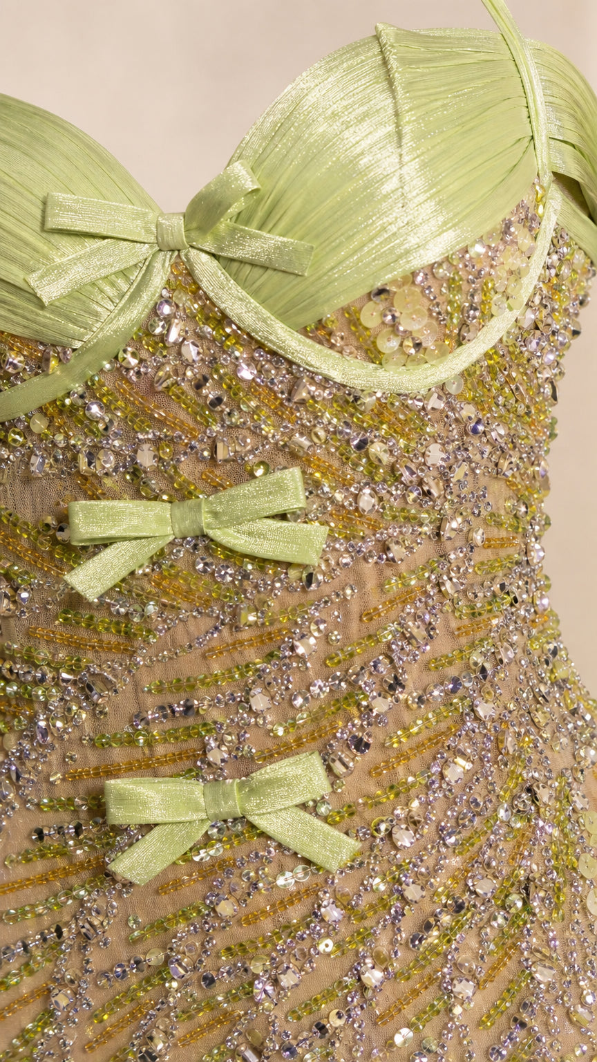 Close-up detail of bodice beadwork, sweetheart neckline, and bows
