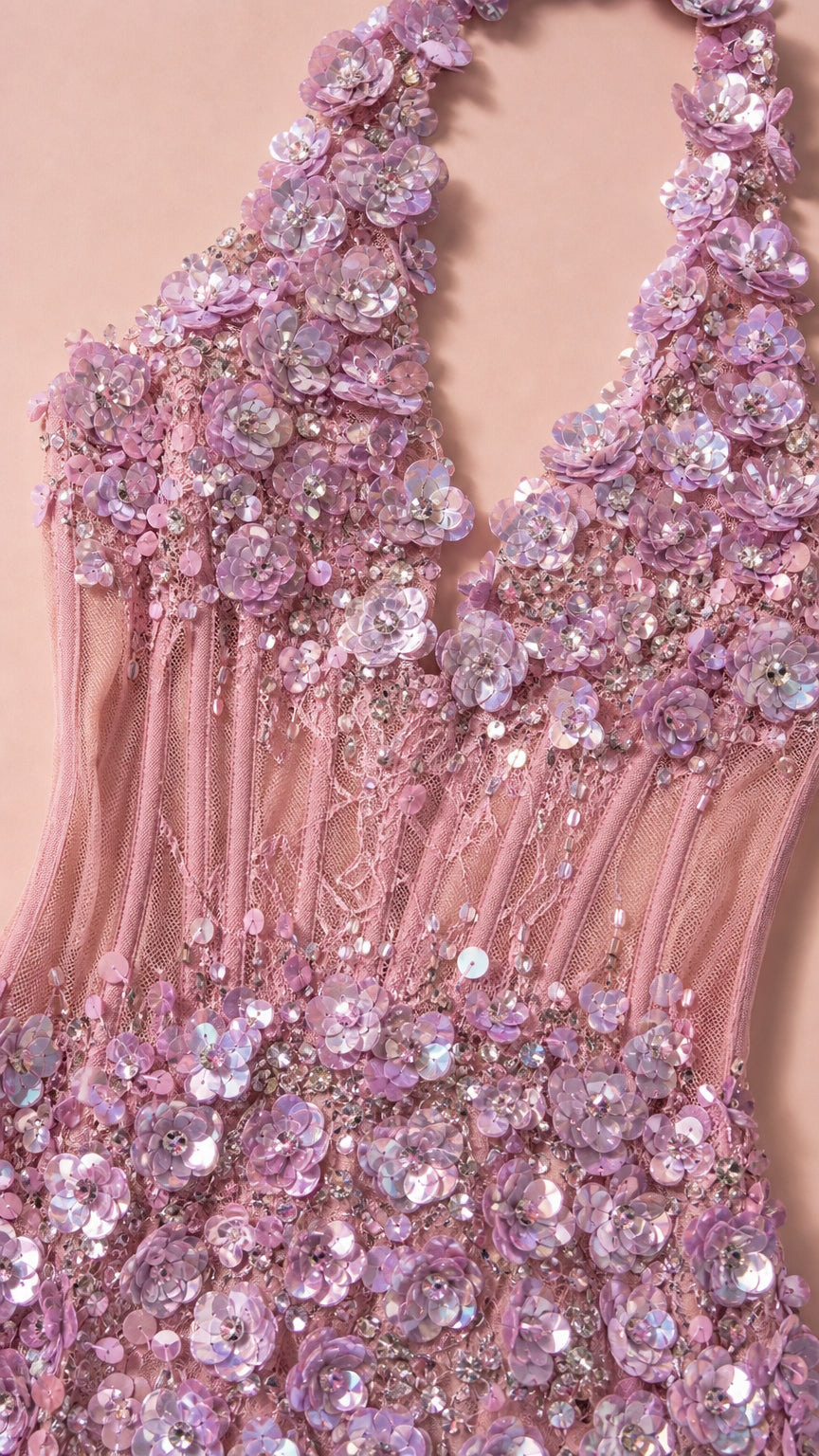 Close-up detail of sheer bodice, plunge neckline, and floral appliques