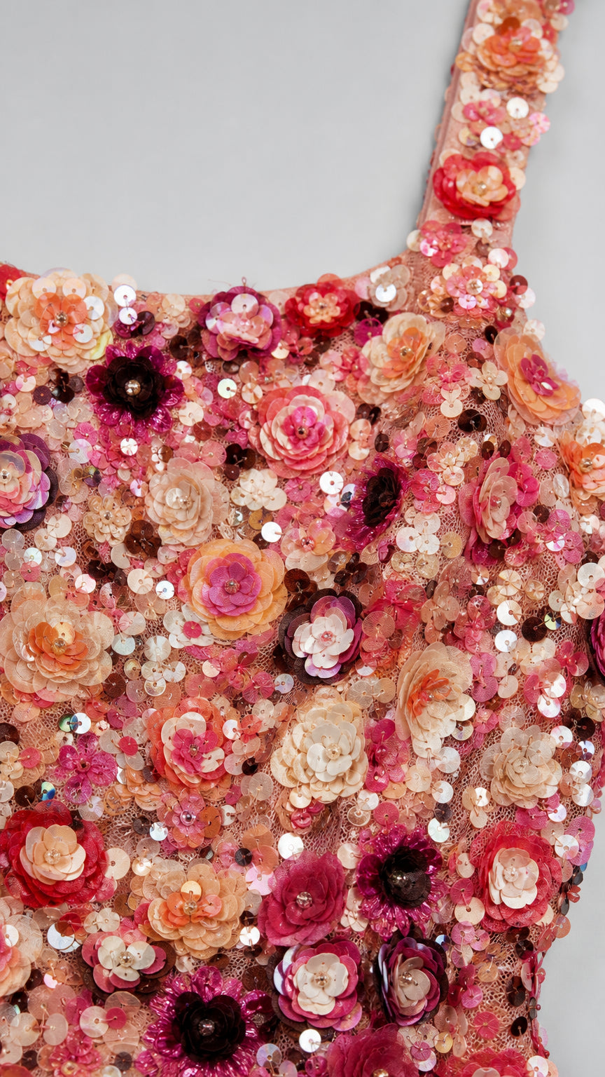 Close-up detail of floral appliqués and sequins