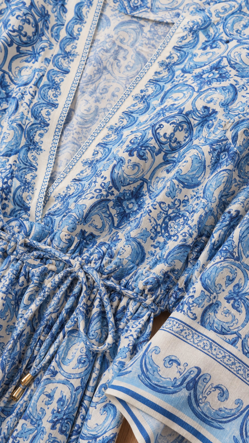 Close-up detail of blue patterned fabric and drawstring waist