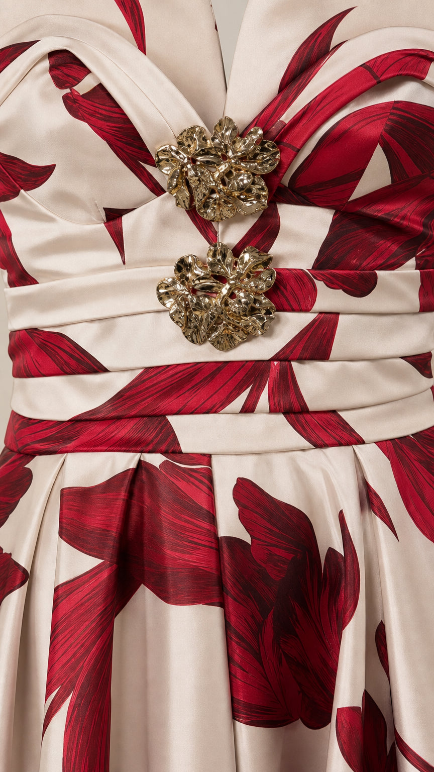 Close-up detail of the rhinestone brooch appliques and pleated bodice