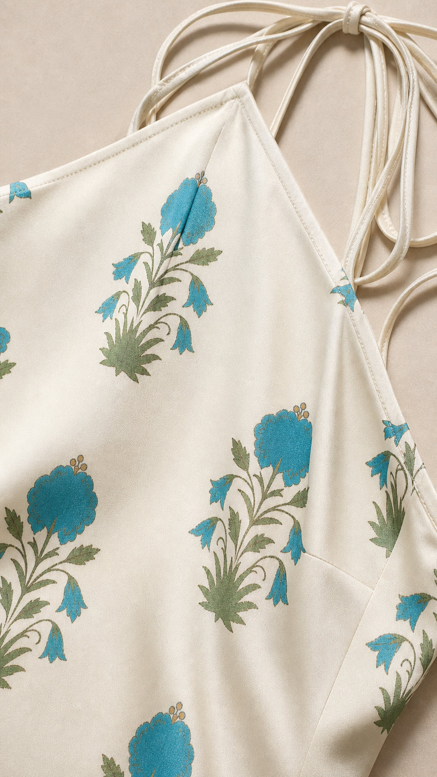 Close-up detail of blue floral pattern on white fabric