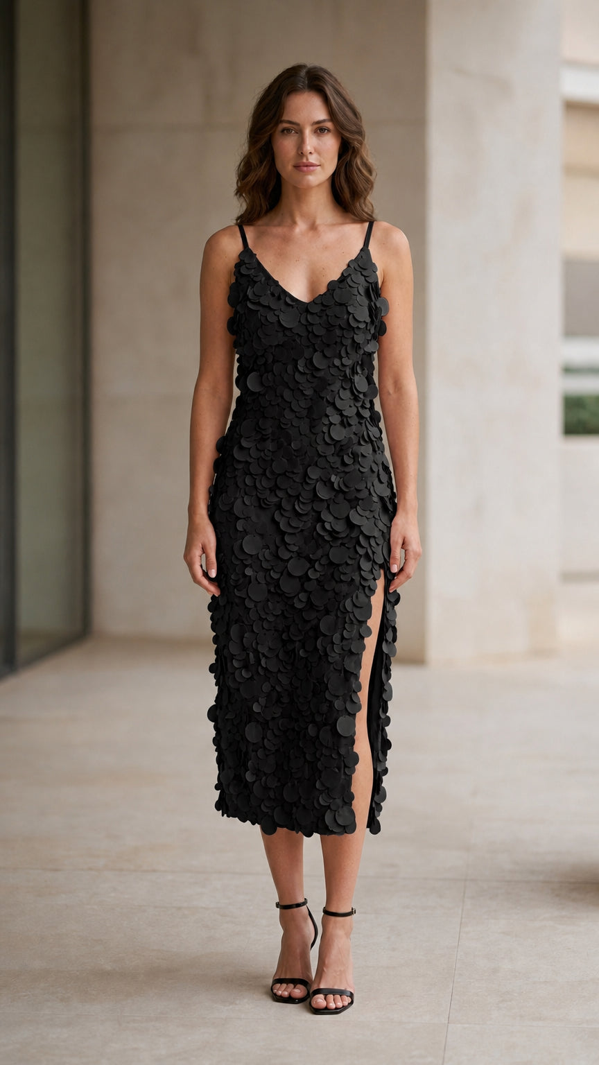 Model wearing black 3D petal applique midi dress