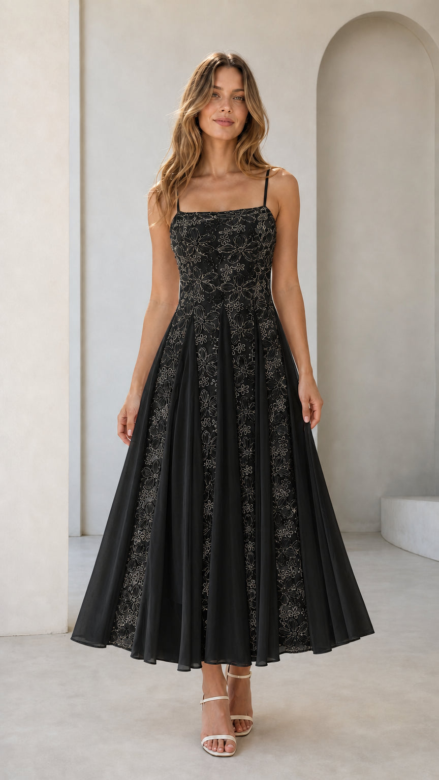 Front view of black floral embroidered midi dress on model