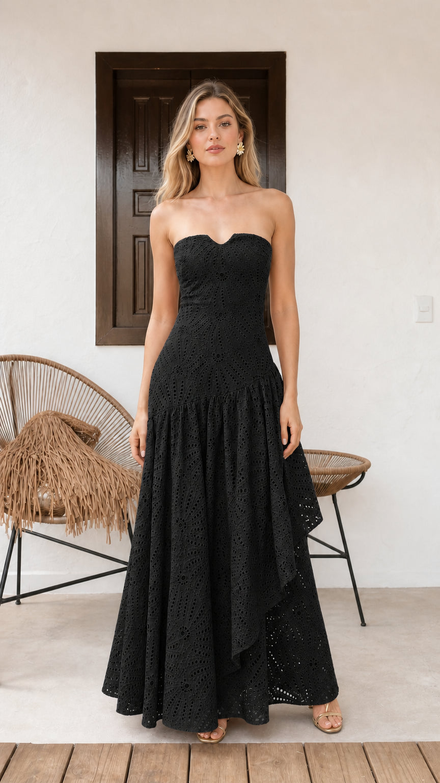 Model wearing black strapless eyelet maxi dress