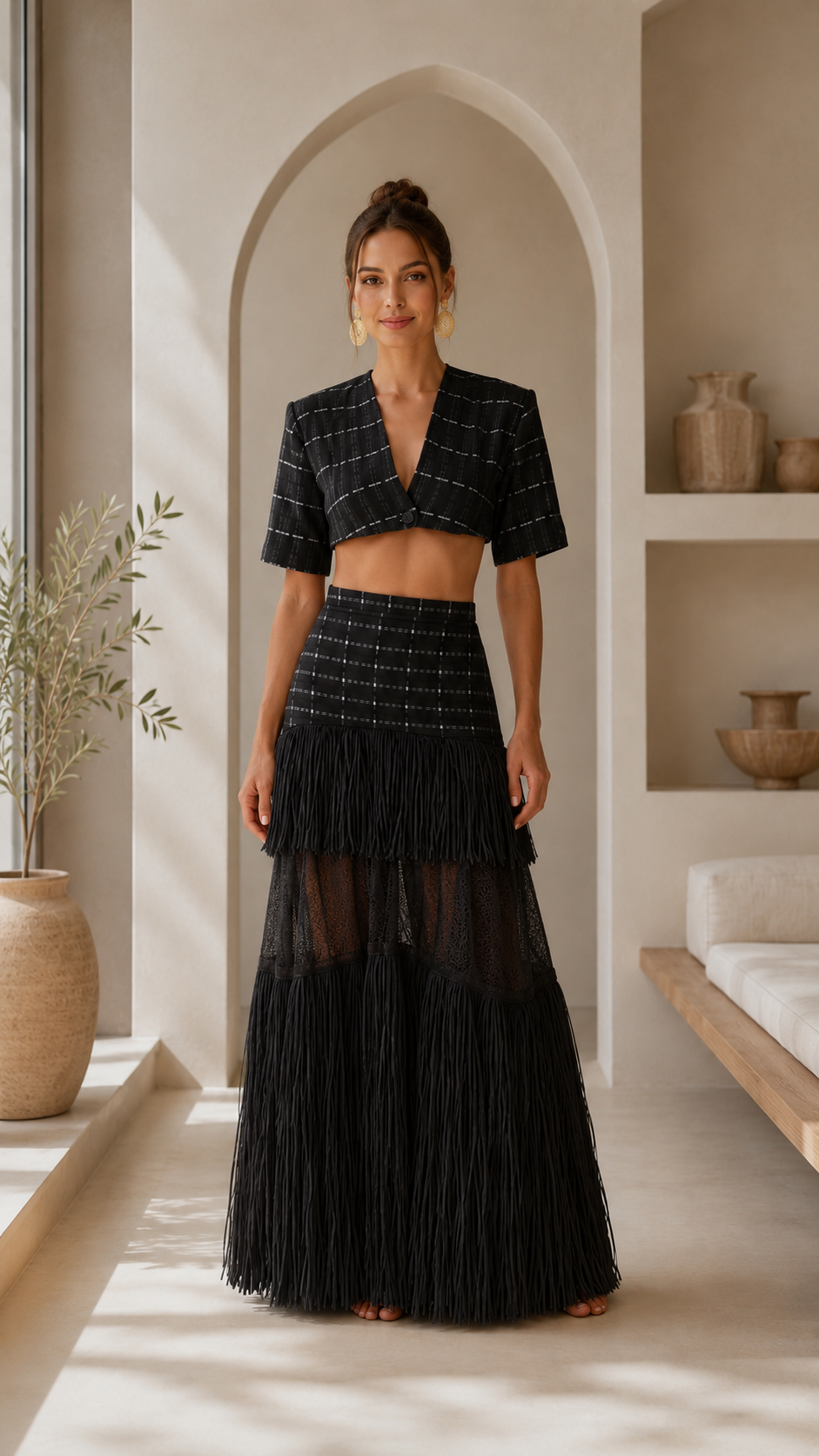 Front view of black crop top and fringe maxi skirt matching set