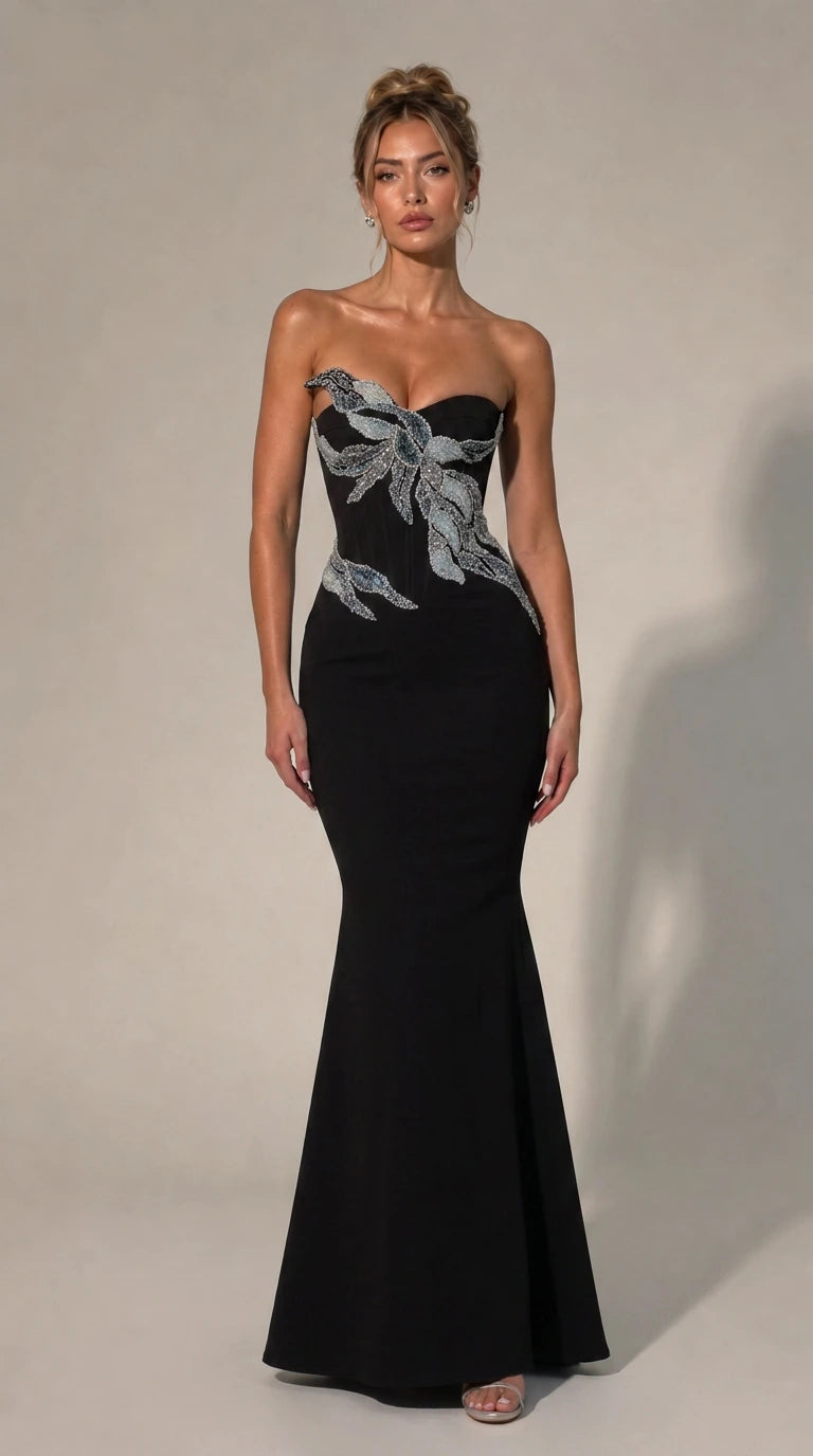 Front view of black strapless beaded evening dress