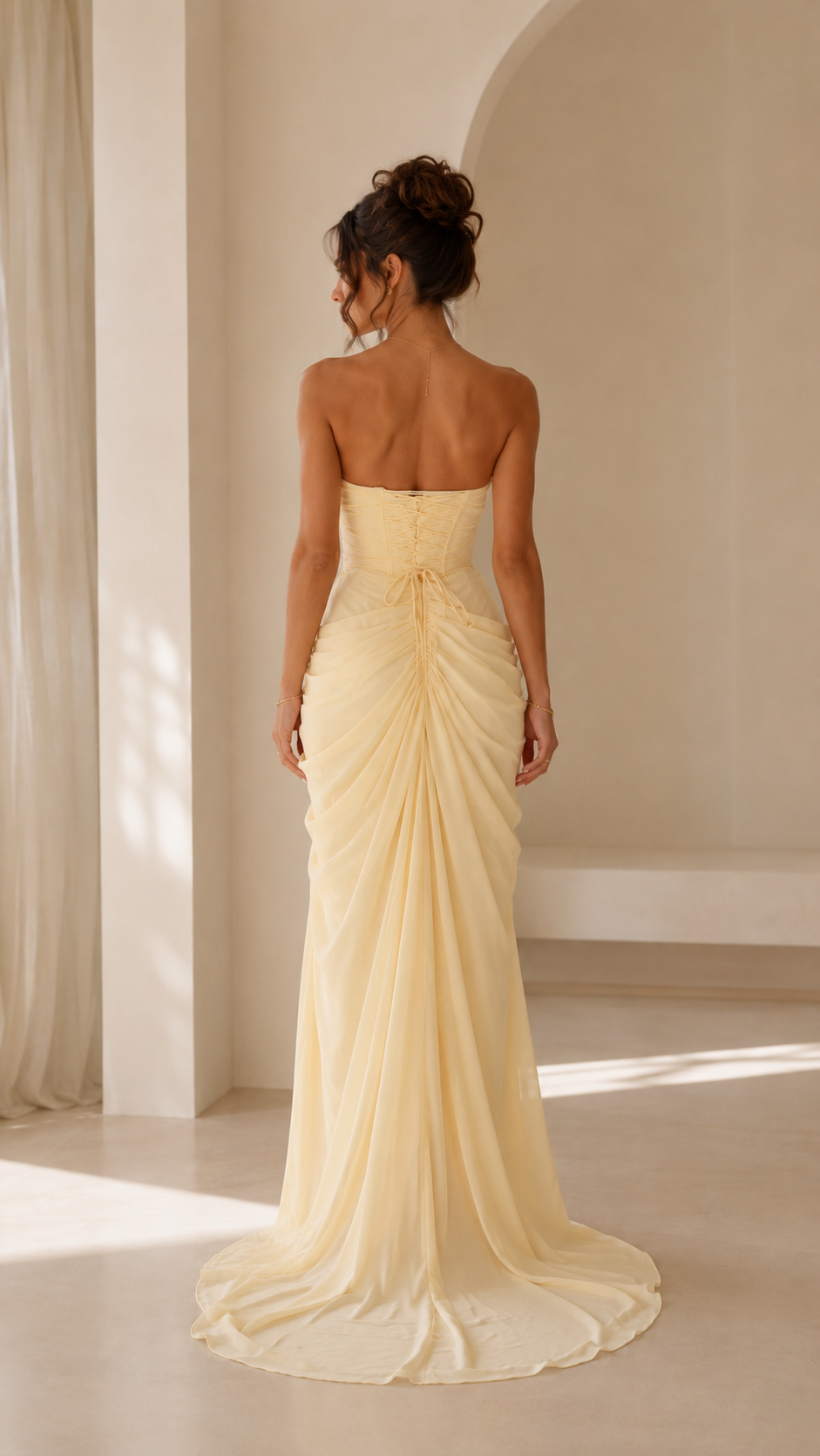 Butter yellow strapless ruched maxi evening dress back view