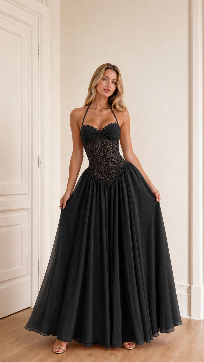 Model wearing black evening dress front view